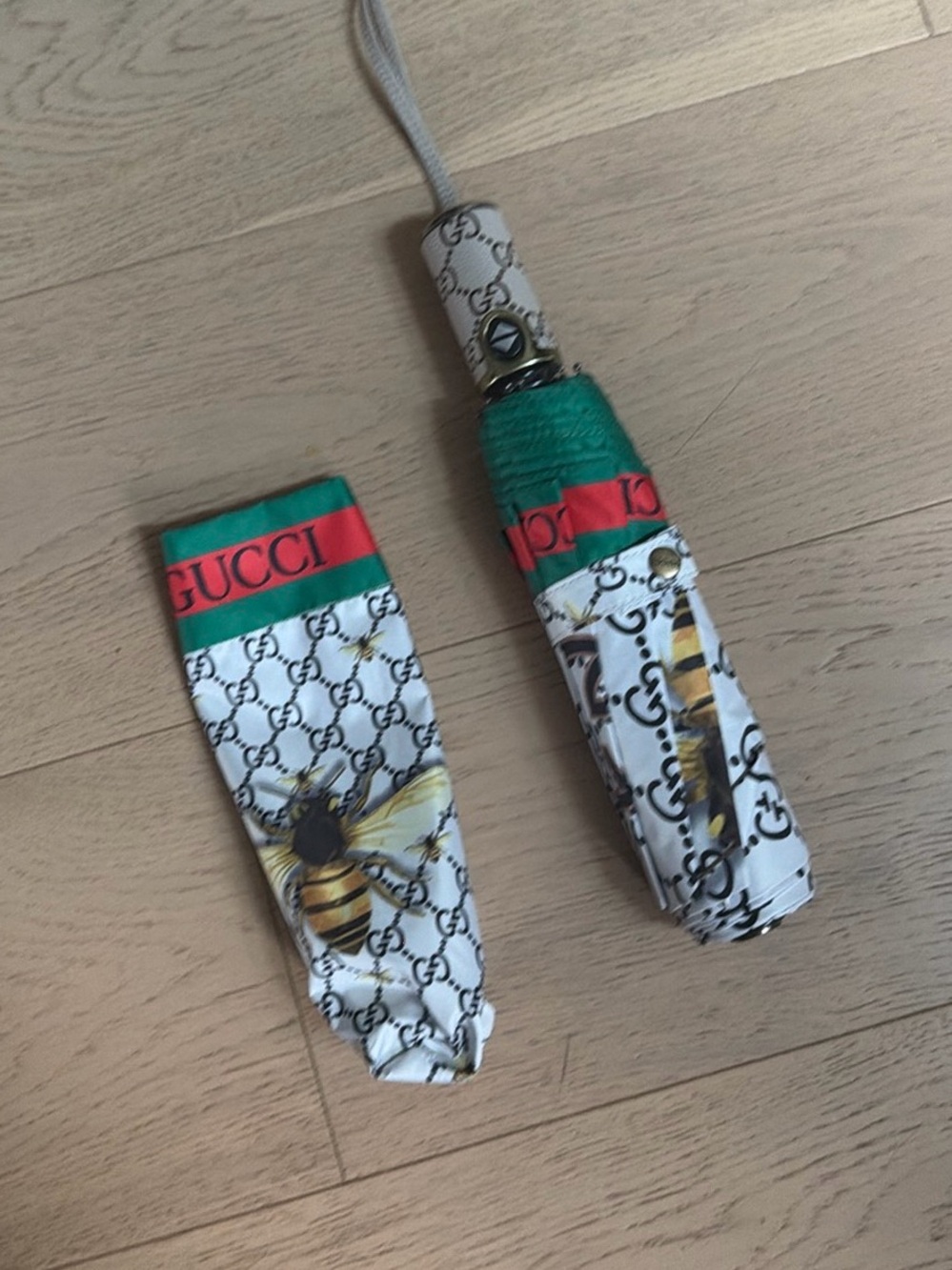 Fun Inspired White Bee Motif Compact Umbrella with Green and Red Trim